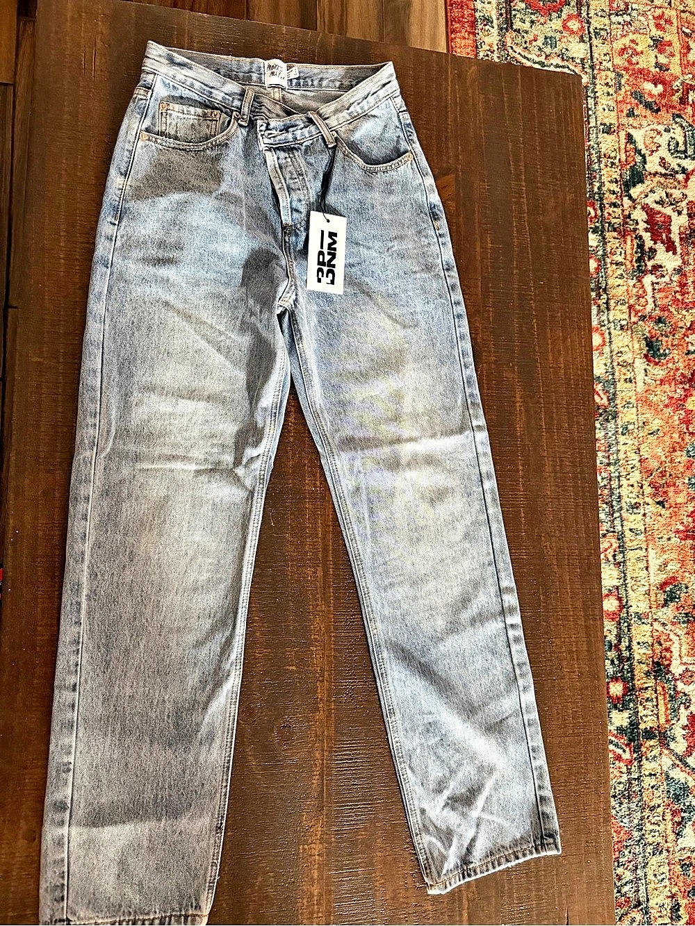 Straight leg asymmetrical jeans.